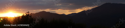 Sunsent in the mountains. Panoramic view.