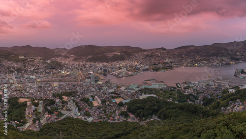Panorama image of the city Nagasaki, at sunset, cloudy sky. © Philippe