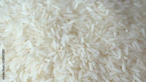 Slow motion of close up falling raw rice / uncook rice. (High speed video)