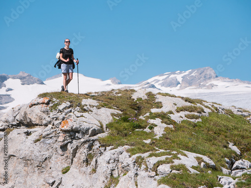 hiker with backpack on the mountain with glacier in background