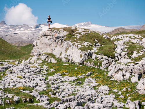 hiker on top of the mountain with glacier in background