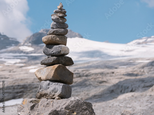 close up from stacked  balanced rocks in front of a glacier in summer beautiful balance