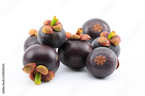 Fresh mangosteens on white background, isolated. Mangosteen, queen of fruits. Tropical fresh fruit.