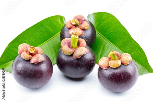 Fresh mangosteens on white background, isolated. Mangosteen, queen of fruits. Tropical fresh fruit.