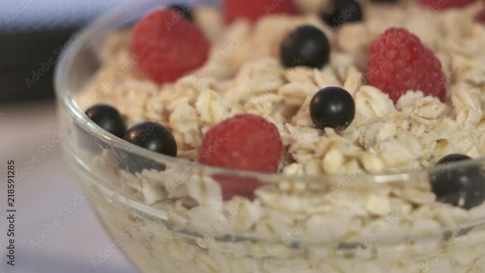 Bowl of oatmeal with fresh berries rotating inside microwave Bowl of oatmeal with fresh berries rotating inside microwave