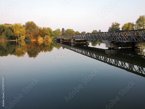 Calm river in beautiful sunrise, green natural lanscape. © Bokicbo