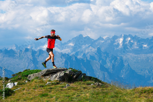 Skyrunning athlete in training on mountain ridges