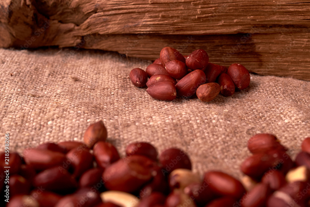 Fototapeta premium Peanut snacks nuts eating snacks red peanuts peanuts fried peanuts. concept of a good Friday rest