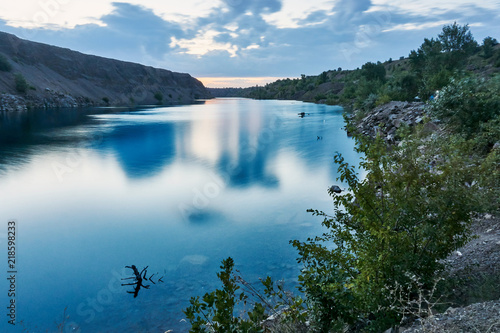 The purest blue lake amid unspoiled nature at dawn on a nice summer day