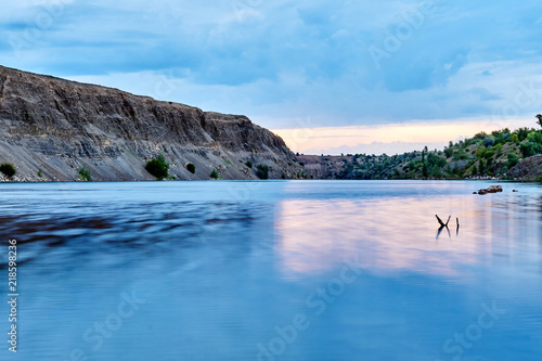 The purest blue lake amid unspoiled nature at dawn on a nice summer day