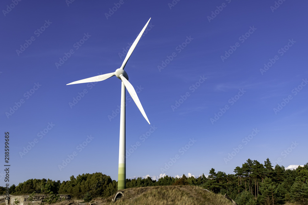 wind power mill on a background of blue sky wind power mill on a background of blue sky