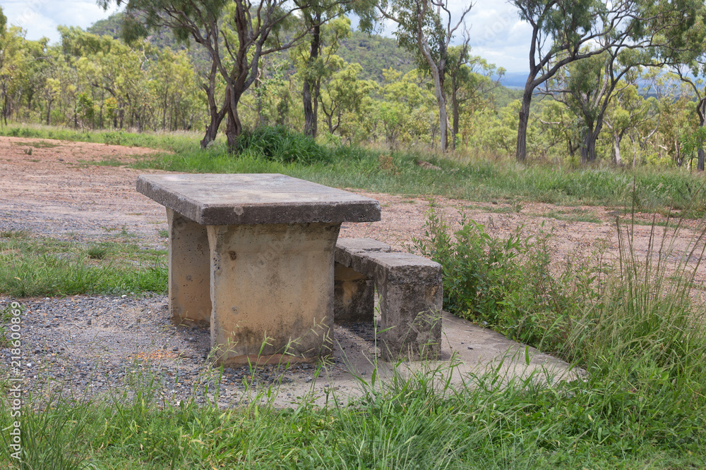 Decaying concrete picnic table and bench on the Atherton Tableland in Queensland, Australia Decaying concrete picnic table and bench on the Atherton Tableland in Queensland, Australia