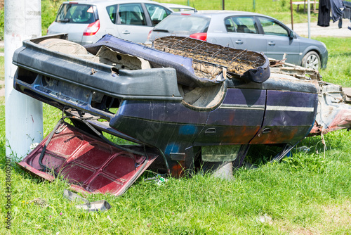 Принти на полотні Abandoned car at roadside in a small town in Romania.