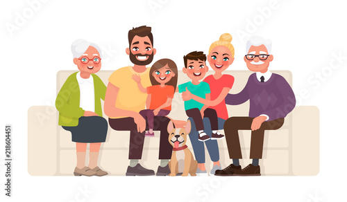 Big happy family sitting on the sofa. Grandmother, grandfather, father, mother, children and pet