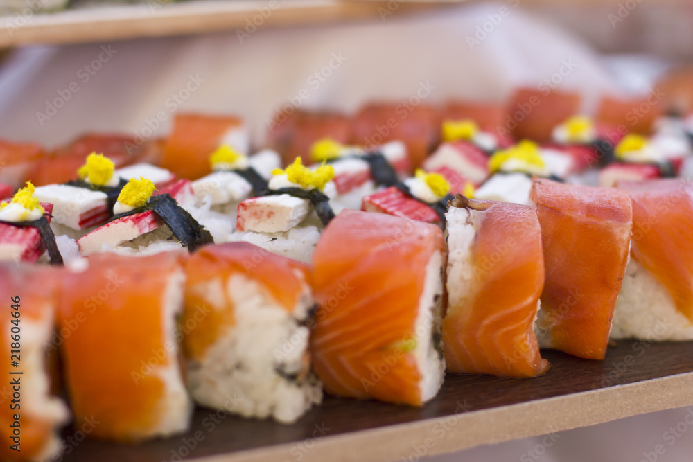Asian cuisine. Sushi, rolls and sashimi in restaurant Asian cuisine. Sushi, rolls and sashimi in restaurant