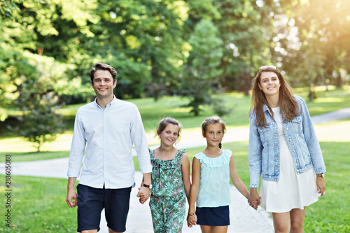 Young family with children having fun in nature