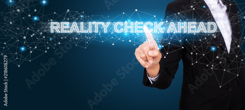 Reality Check Ahead concept with Hand of business pressing a button Reality Check Ahead