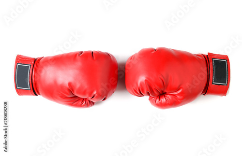 Pair of red leather boxing gloves isolated © kwanchaichaiudom