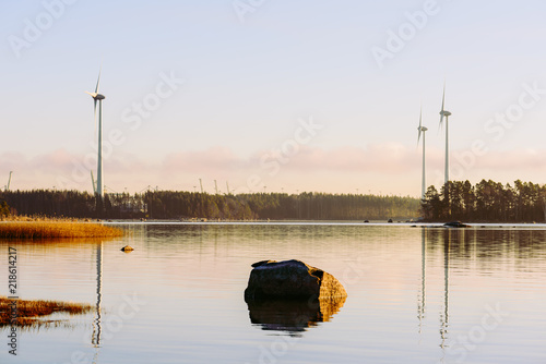 Autumn view at port of Kotka, Finland and farm of wind electricity generators photo