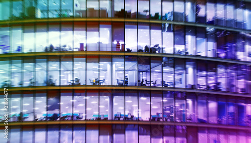 abstract office bulding with people working at night. radial blur