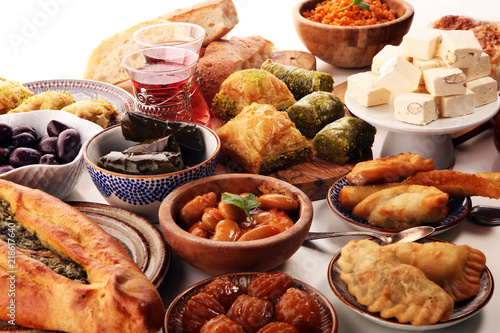 Middle eastern or arabic dishes and assorted meze, concrete rustic background. sambusak. Turkish Dessert Baklava with pistachio. Sarma. Halal food. Lebanese