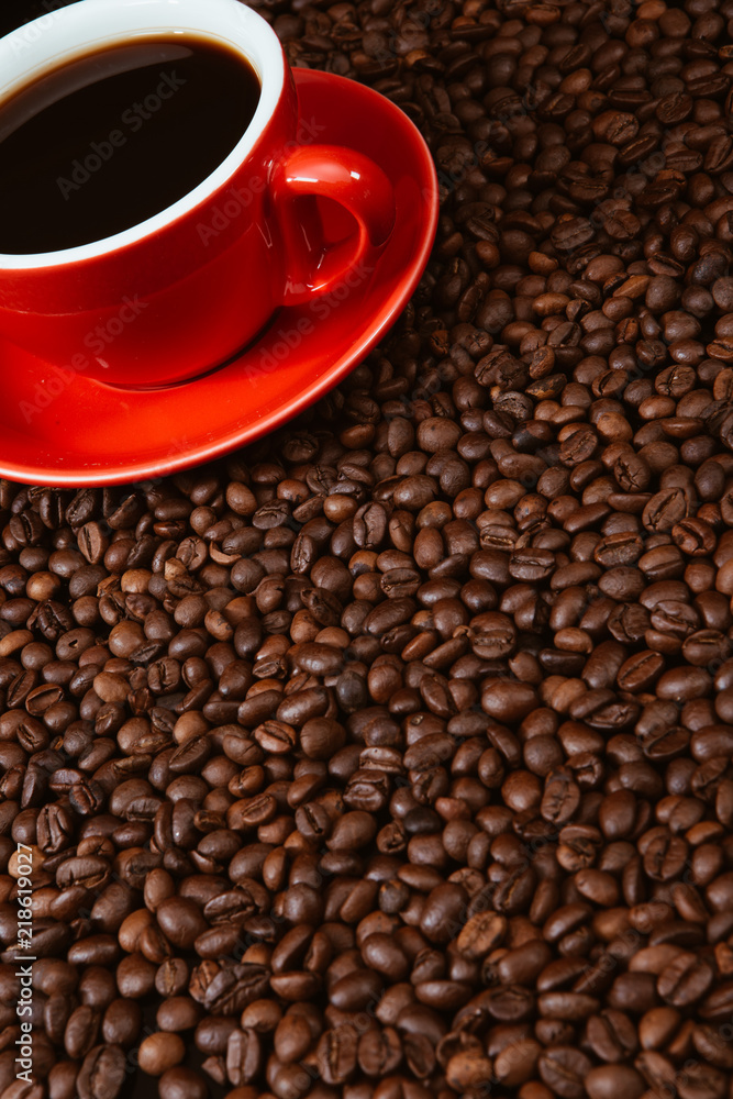 Red coffee cup with coffee beans . Red coffee cup with coffee beans .