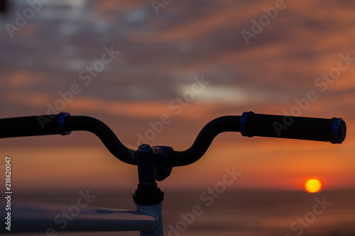 Bicycle handlebars and sunset