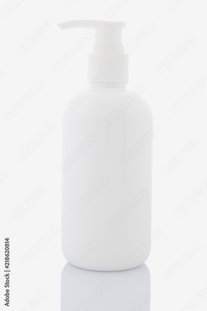 White liquid dispenser bottle isolated on white White liquid dispenser bottle isolated on white
