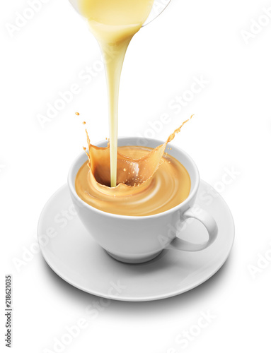 Milk pouring into a cup.