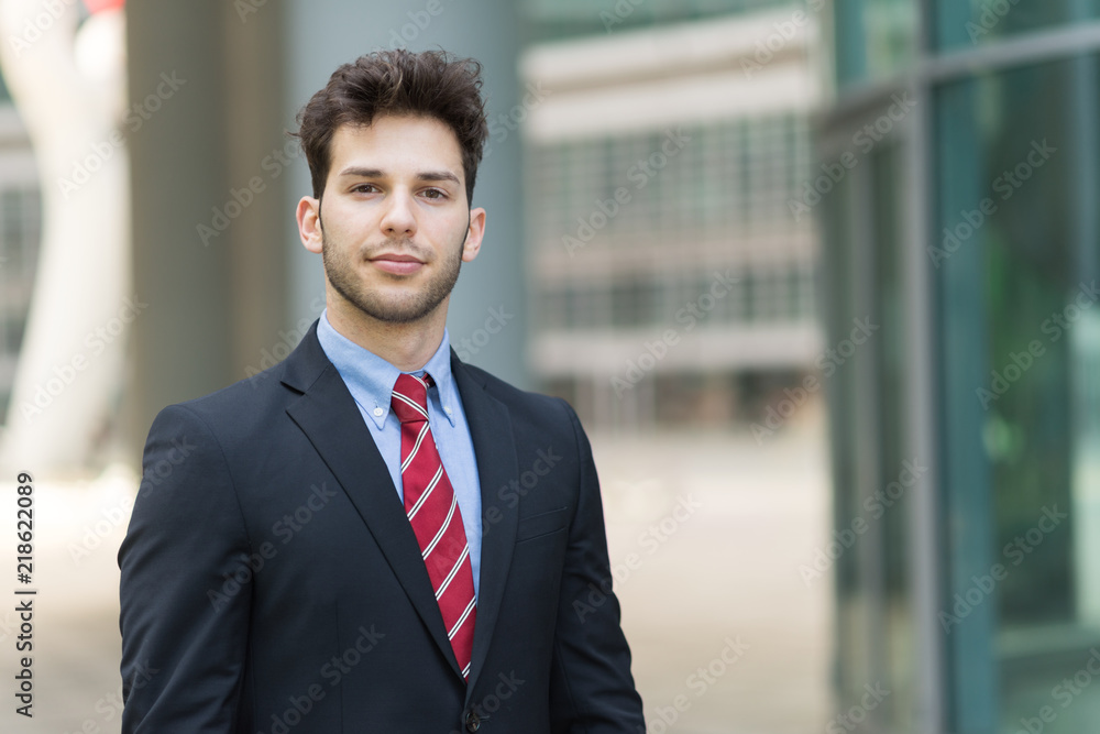 Portrait of an handsome businessman in a business environment Portrait of an handsome businessman in a business environment