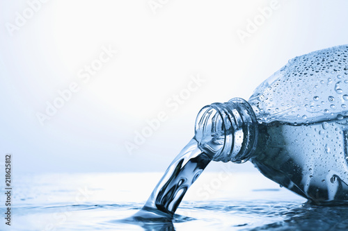 Water spilling from plastic bottle