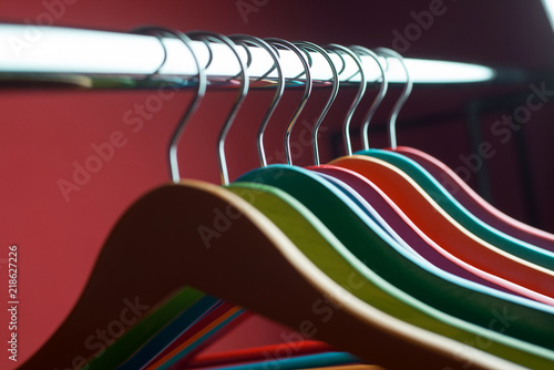 Modern hangers on orange wall background