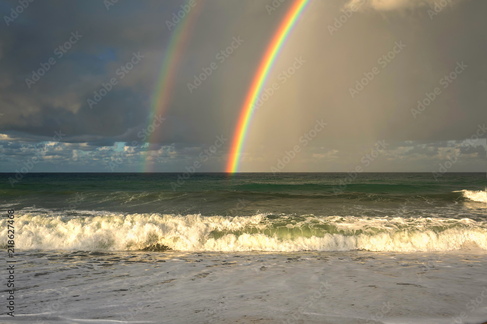 Rainbow over the sea and tropical beach. Rainbow over the sea and tropical beach.