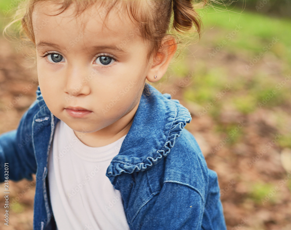 Portrait of baby girl in park. Portrait of baby girl in park.