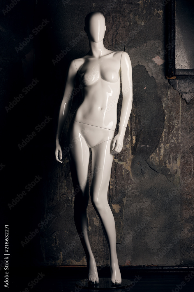 White female mannequin closeup. Head without a face and glossy surface White female mannequin closeup. Head without a face and glossy surface