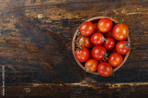 cherry tomatoes on a wooden background