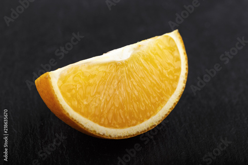 orange slice on a black background