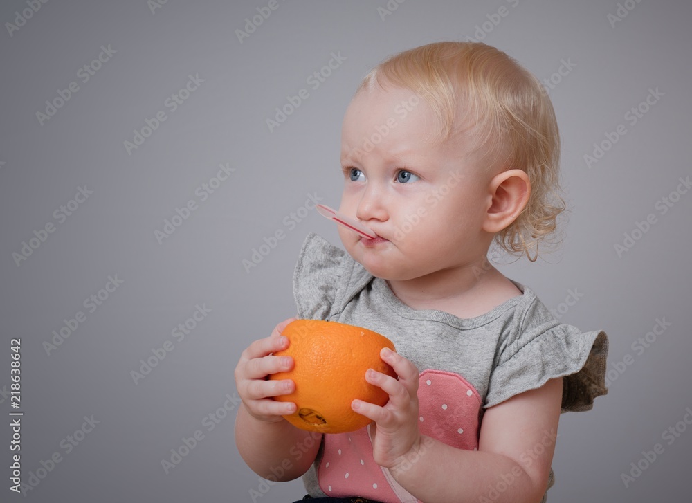 Happy kid drinking juice 