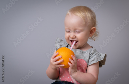 Happy kid drinking juice 