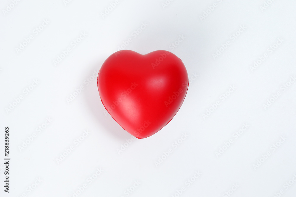 Hart Love shape plastic rubber object on white background