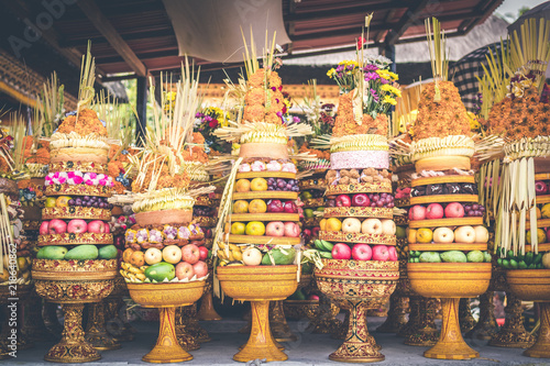 Fototapeta Naklejka Na Ścianę i Meble -  Traditional balinese offerings to Gods with fruits in basket.