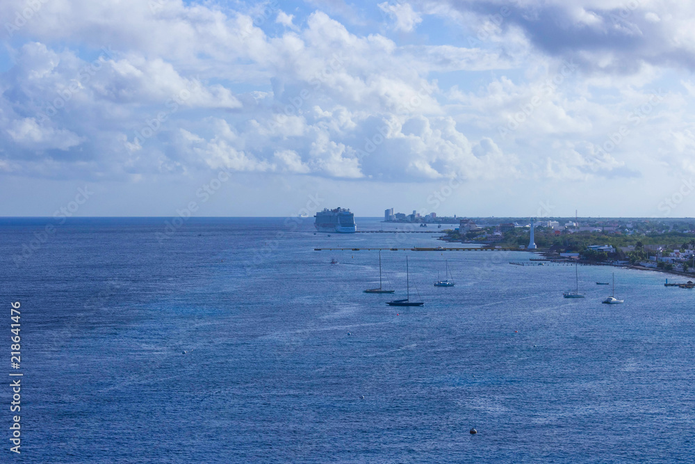 The coastline and port with blue caribbean water at Cozumel at Mexico