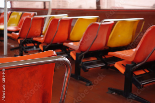 Colourful of seats row inside ferry boat