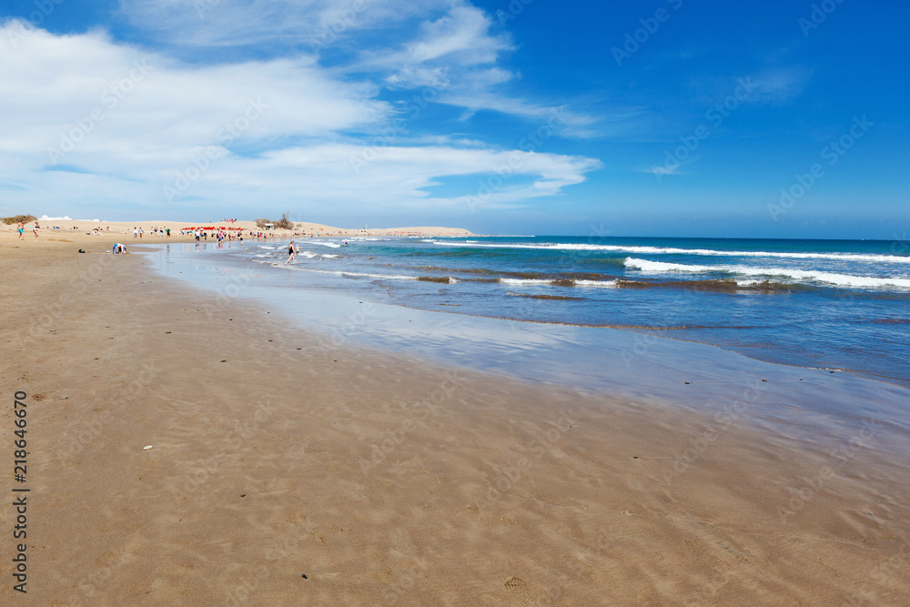 Sandy beach in Maspalomas, Gran Canaria, Canary islands, view of the sea, beach, blue sky, selective focus