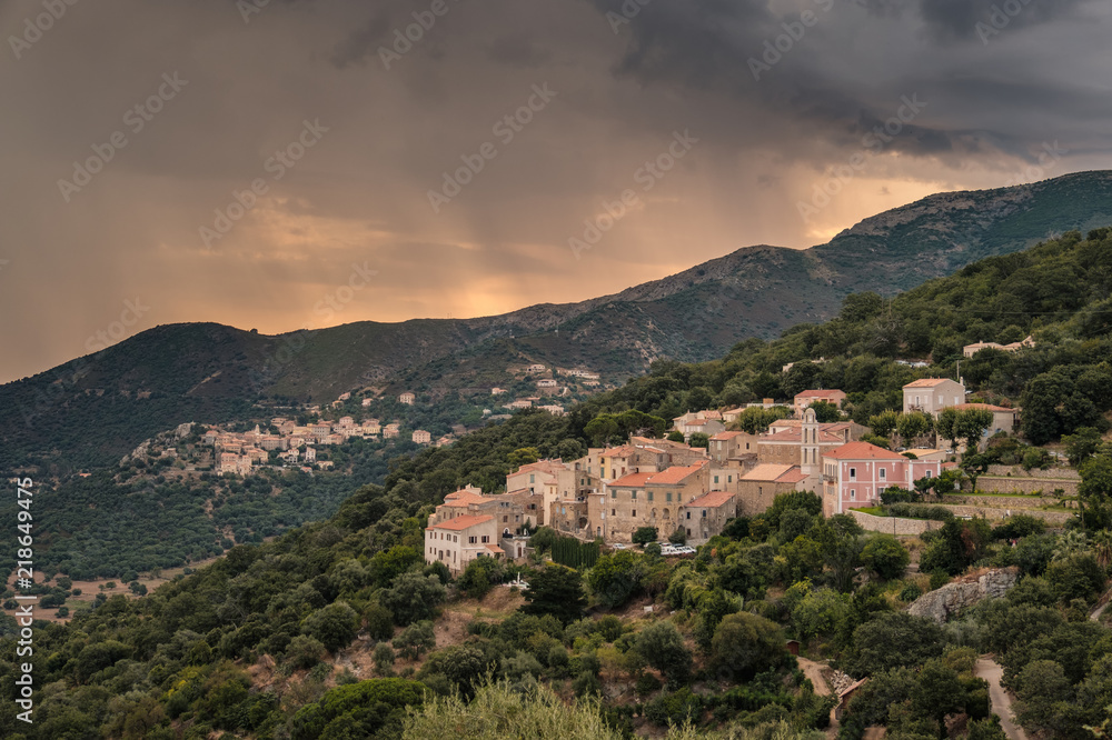 Stormy sunrise over village of Costa in Corsica