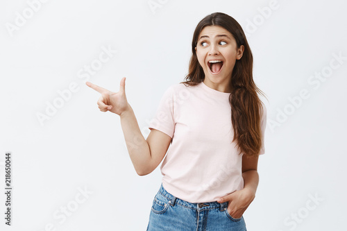 Fotografie Waist-up shot of thrilled and amused excited good-looking woman with brown long