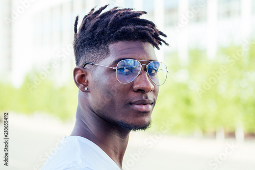 Valokuva portrait stylish and handsome African student American man with cool dreadlocks
