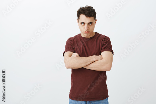 Schilderij op canvas Offended disappointed attractive guy in casual clothes, holding hands crossed on