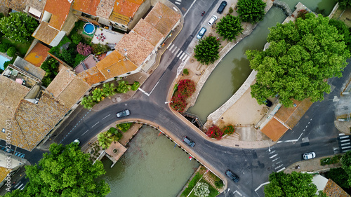 Aerial top view of boats and lock in Canal du Midi, road and bridge from above, Southern France
 photo