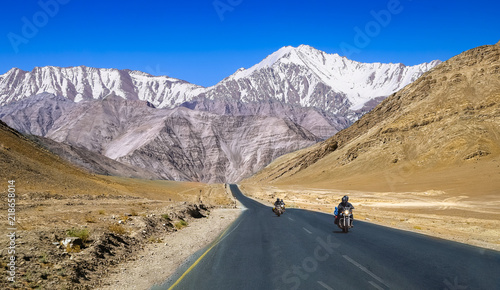 Indian bikers travel on national highway with scenic landscape at Ladakh India. photo